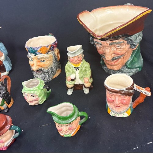 112 - Selection of character jugs to include some  Royal Doulton pieces