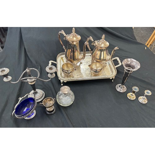 133 - Selection of metal ware includes silver topped glass jar, tea pots etc