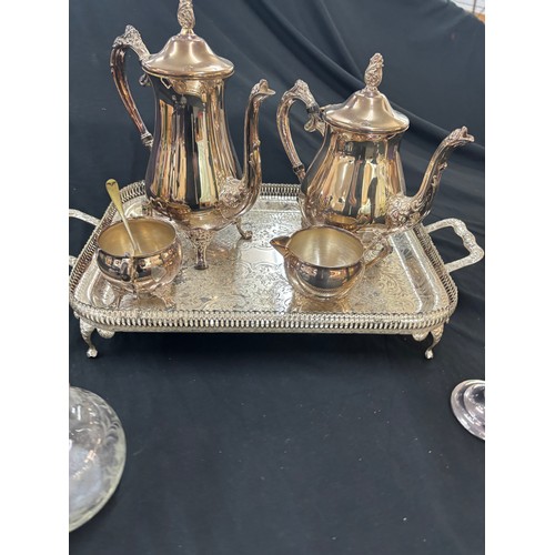 133 - Selection of metal ware includes silver topped glass jar, tea pots etc