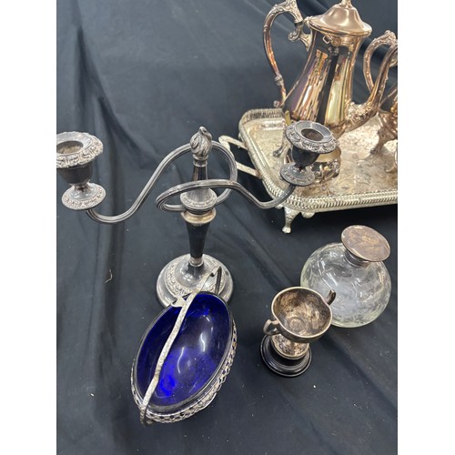 133 - Selection of metal ware includes silver topped glass jar, tea pots etc