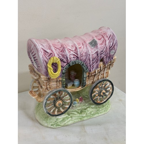 42 - Porcelain gypsy carriage measures approximately 7 inches tall by 8 inches wide