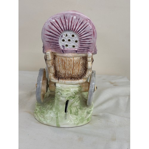 42 - Porcelain gypsy carriage measures approximately 7 inches tall by 8 inches wide