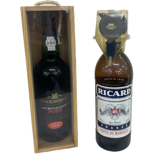 511 - Two unsealed bottles of alcohol ' Richards' and ' Cockburns Port'