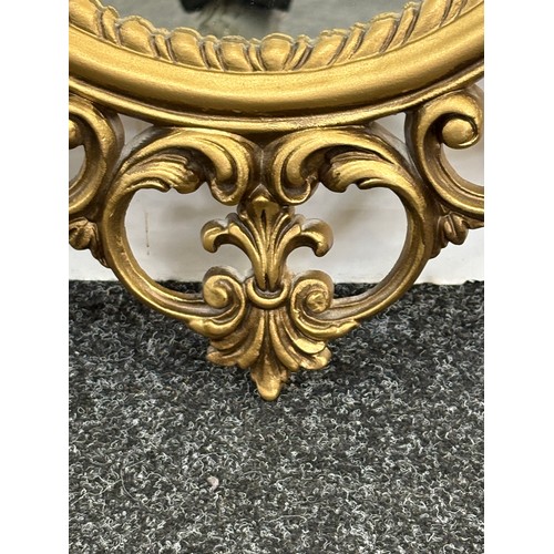 62 - Gilt framed wall hanging mirror measures approximately 36 inches tall 21 inches wide