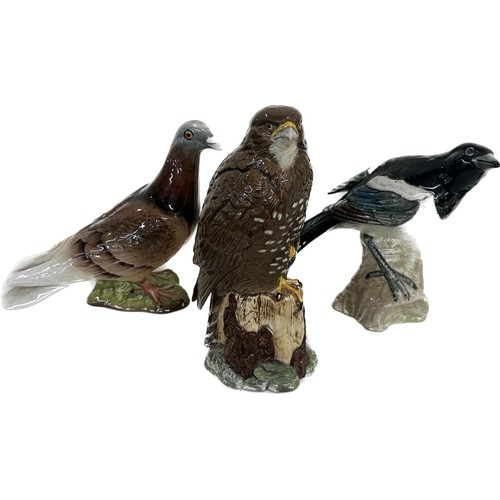 3 - Three Beswick bird ornaments a pigeon, magpie and eagle, tallest measures approximately 7.5 inches t... 