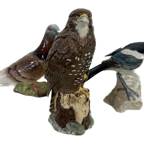 3 - Three Beswick bird ornaments a pigeon, magpie and eagle, tallest measures approximately 7.5 inches t... 