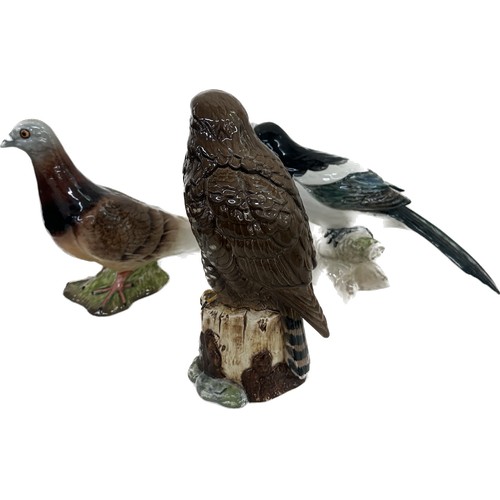 3 - Three Beswick bird ornaments a pigeon, magpie and eagle, tallest measures approximately 7.5 inches t... 