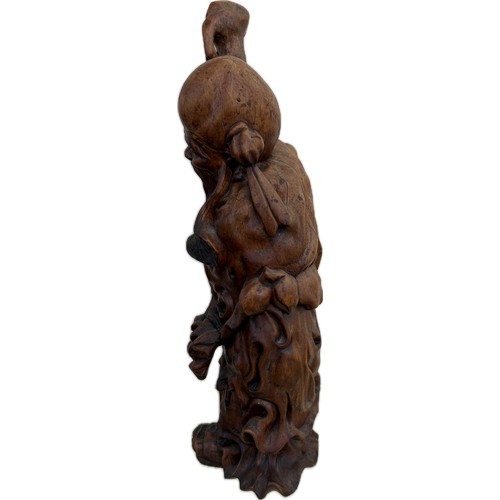 32 - Oriental carved wooden figure height 18 inches tall