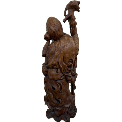 32 - Oriental carved wooden figure height 18 inches tall