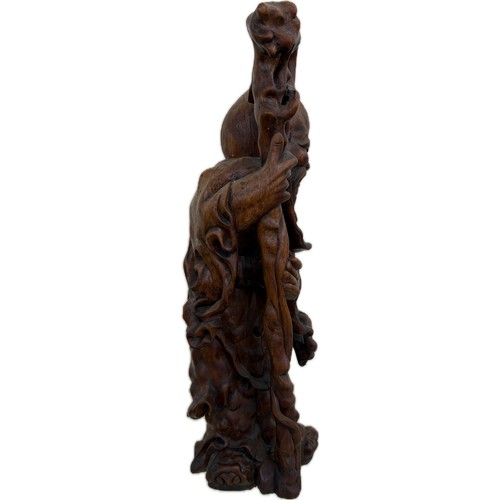 32 - Oriental carved wooden figure height 18 inches tall