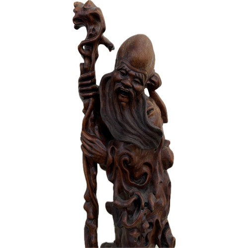 32 - Oriental carved wooden figure height 18 inches tall