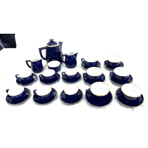 131 - Blue and Gold 6 piece tea set, complete with tea pot, a long with blue and gold 6 piece coffee cups ... 