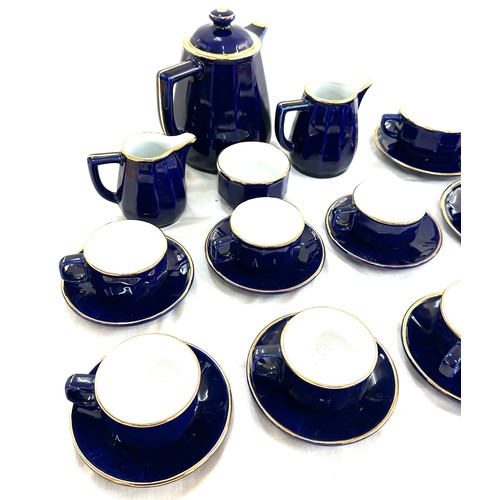 131 - Blue and Gold 6 piece tea set, complete with tea pot, a long with blue and gold 6 piece coffee cups ... 