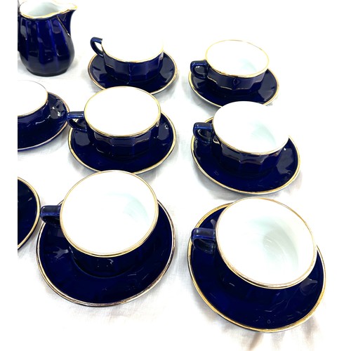 131 - Blue and Gold 6 piece tea set, complete with tea pot, a long with blue and gold 6 piece coffee cups ... 