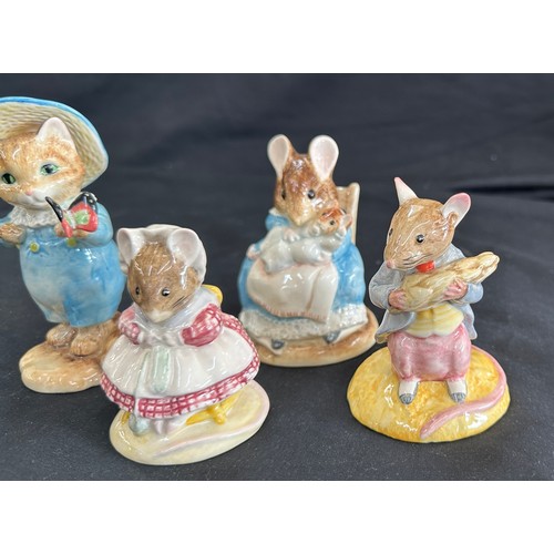 87 - Four vintage Beatrix Potter figures to include ' Hunca Munca and Baby', ' The Old Woman who lived in... 