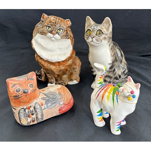 68 - Selection of porcelain cat figures, one with glass eyes and signed, another one with three signature... 