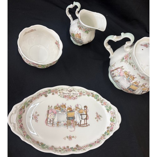 155 - Royal Doulton Bramley Hedge tea service comprising of teapot, milk jug, sugar bowl, tray