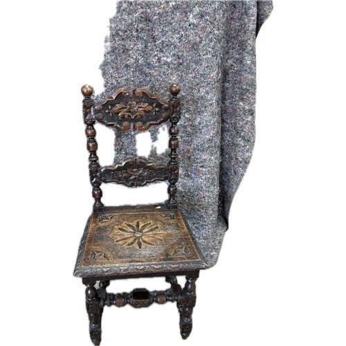 241 - Antique heavily carved chair