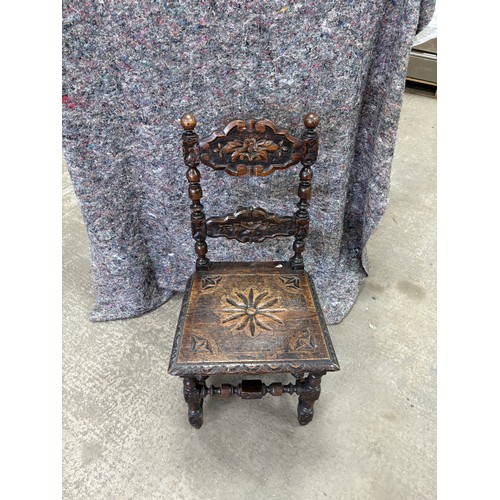 241 - Antique heavily carved chair