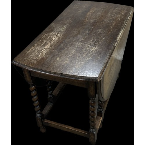 278 - Oak barley twist gate leg table measures approximately with leaf down 29 inches tall x 42 wide and 1... 