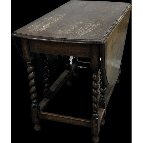 278 - Oak barley twist gate leg table measures approximately with leaf down 29 inches tall x 42 wide and 1... 