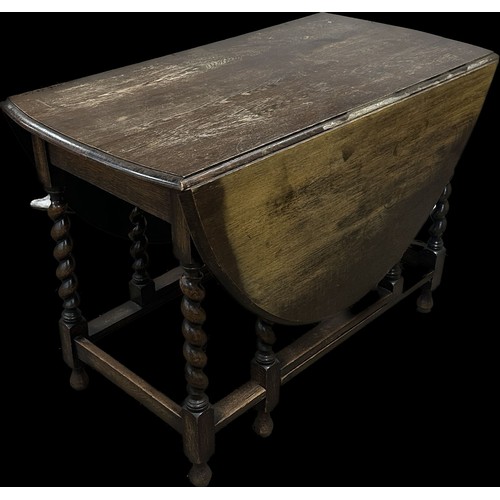 278 - Oak barley twist gate leg table measures approximately with leaf down 29 inches tall x 42 wide and 1... 