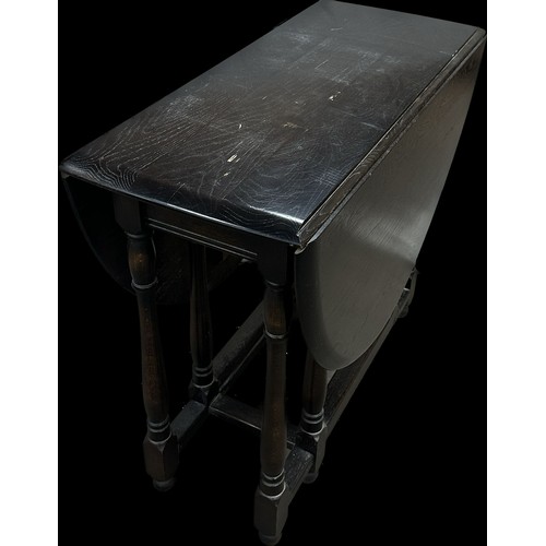 267 - Possibly Ercol gate leg table measures approximately 34 inches wide by 16 deep and 29 tall