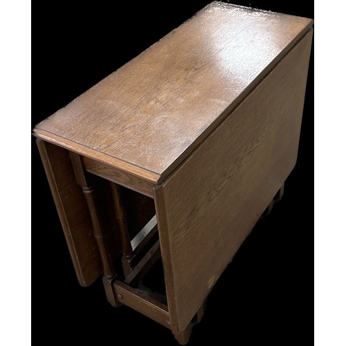 257 - Heavy solid oak gate leg table measures approximately with leaf down 28 inches tall x 34 long and 15... 