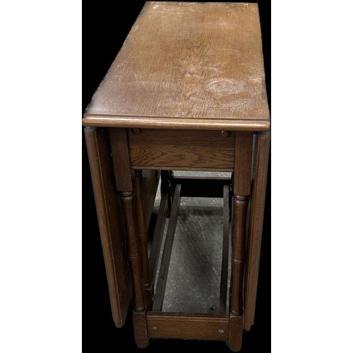 257 - Heavy solid oak gate leg table measures approximately with leaf down 28 inches tall x 34 long and 15... 