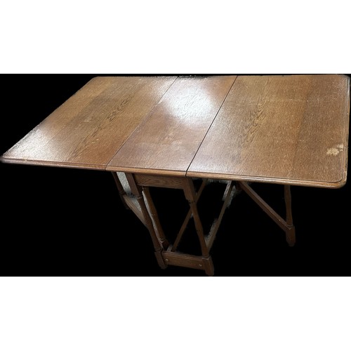 257 - Heavy solid oak gate leg table measures approximately with leaf down 28 inches tall x 34 long and 15... 