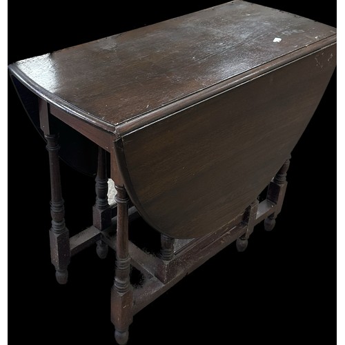 280 - Oak gate leg table measures with leaf down approx 30 inches tall x 36 wide and 17 deep