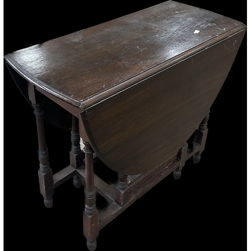 280 - Oak gate leg table measures with leaf down approx 30 inches tall x 36 wide and 17 deep
