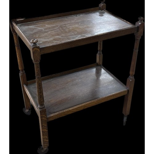 242 - Oak two tier tea trolley measures approximately 32 inches tall x 25 long and 17 deep