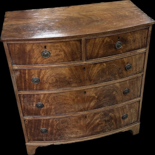 261 - Antique two over three flamed magohany bow fronted chest measures approximately 40 inches tall x 36 ... 