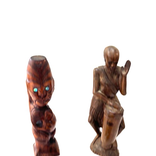 193 - Selection of carved African figures tallest measures 15.5 inches tall