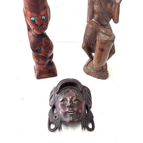 193 - Selection of carved African figures tallest measures 15.5 inches tall