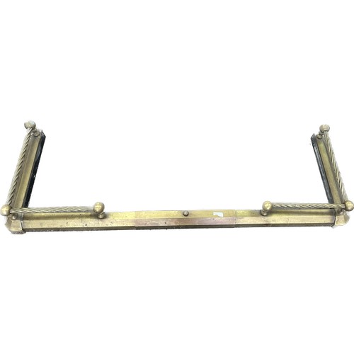 254 - Brass fire fender measures approximately 50 inches wide