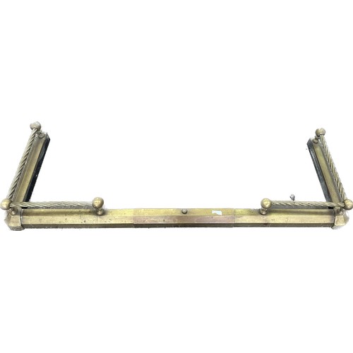 254 - Brass fire fender measures approximately 50 inches wide