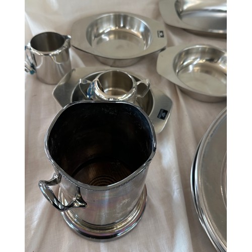 180 - Selection of metalware items to include stainless steel meat trays, a metal fondue stove etc