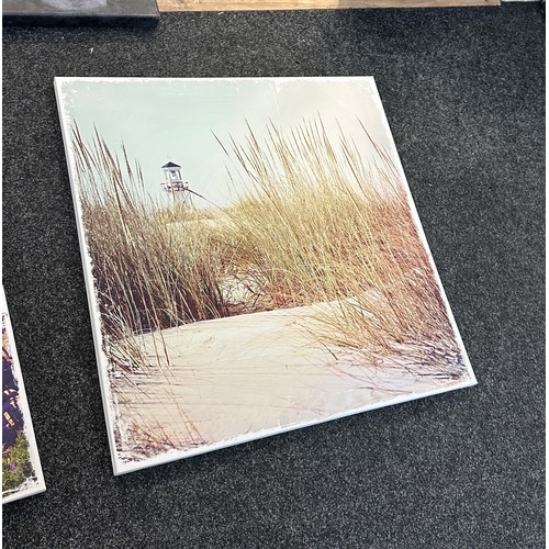 121 - Selection of three canvas art work depicting sandy beach scenes etc and one picture largest measures... 