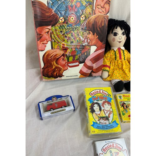144 - Selection of vintage toys and games to include Rosie and Jim dolls, jigsaw puzzles and videos, along... 