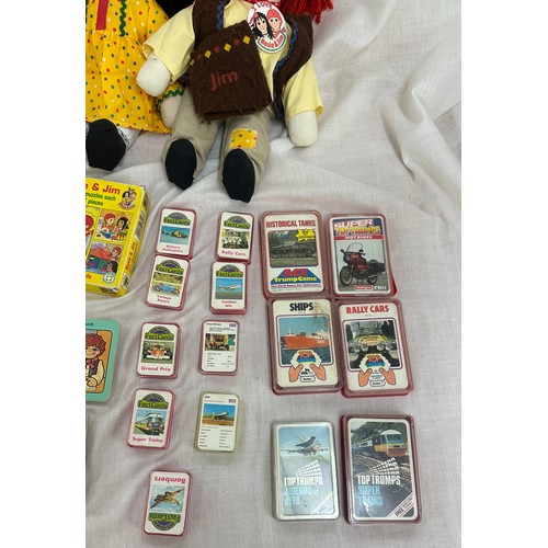 144 - Selection of vintage toys and games to include Rosie and Jim dolls, jigsaw puzzles and videos, along... 