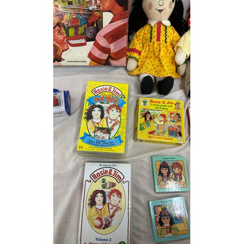144 - Selection of vintage toys and games to include Rosie and Jim dolls, jigsaw puzzles and videos, along... 