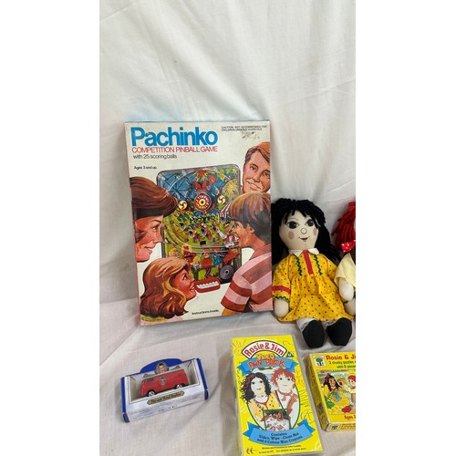 144 - Selection of vintage toys and games to include Rosie and Jim dolls, jigsaw puzzles and videos, along... 