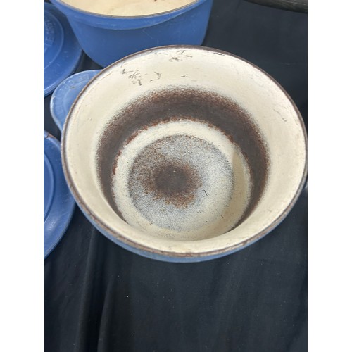 129 - Selection of vintage blue Le Creuset pots