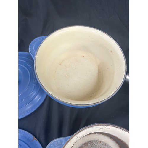 129 - Selection of vintage blue Le Creuset pots