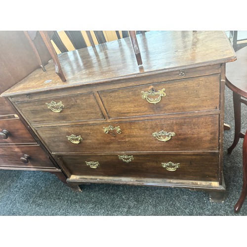 249 - Antique two over two oak chest with brush slide and key  measures approximately 32 inches tall x 40 ... 