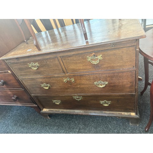 249 - Antique two over two oak chest with brush slide and key  measures approximately 32 inches tall x 40 ... 