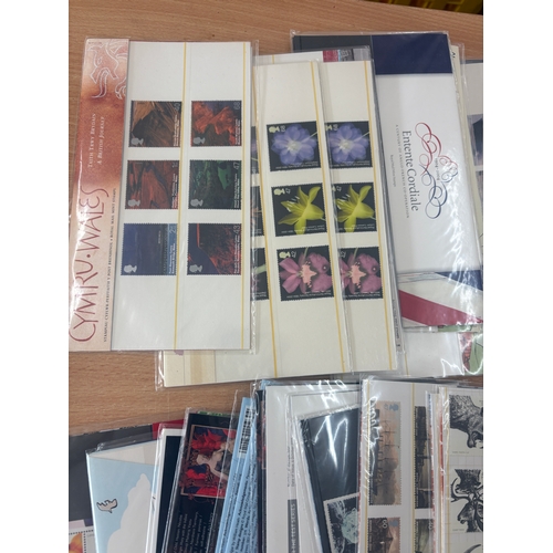 Large selection of sealed stamp presentation packs