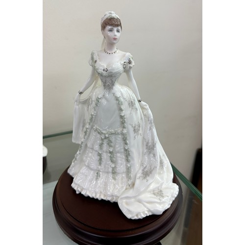 585 - Two Coalport lady bride figurines ' The Queen' and ' Queen Mary' both on wooden plinths, approximate... 